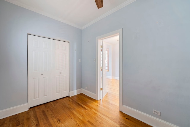 3022 N Hamilton Ave, Chicago, IL 60618 - unfurnished bedroom with light wood-type flooring, baseboards, a closet, and ornamental molding