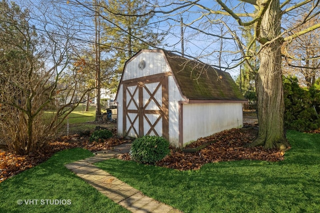 view of outbuilding with a yard