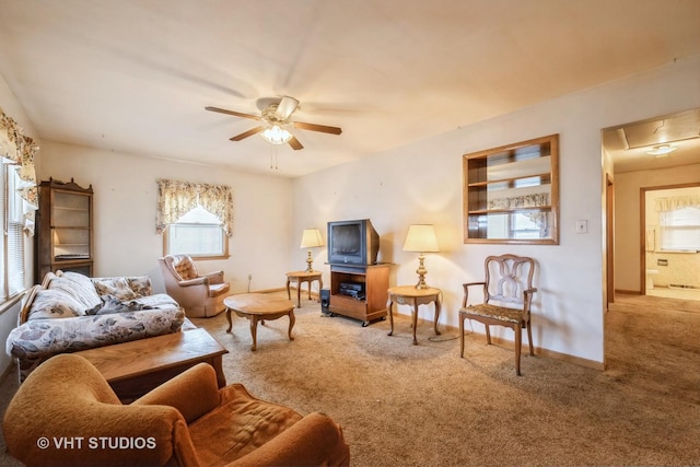 carpeted living room featuring ceiling fan