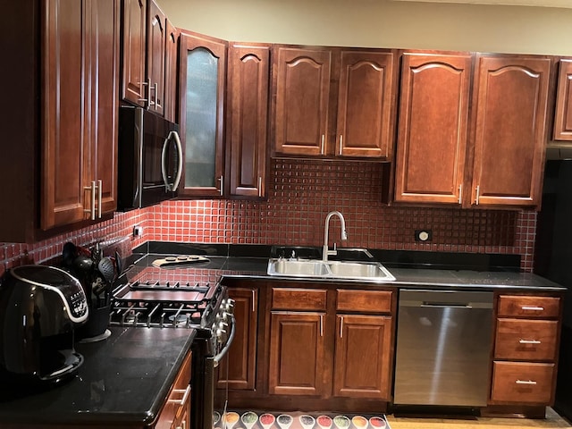 kitchen featuring backsplash, stainless steel appliances, and sink