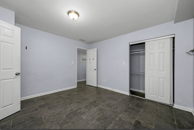 unfurnished bedroom featuring a closet