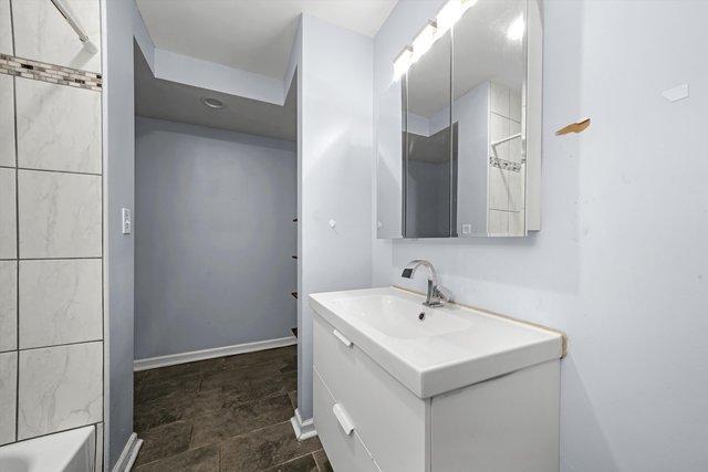 bathroom with vanity and shower / tub combination