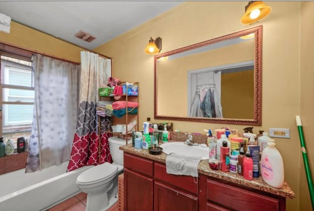 full bathroom featuring shower / bathtub combination with curtain, tile patterned floors, vanity, and toilet