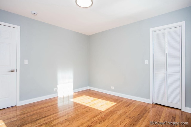 unfurnished bedroom featuring hardwood / wood-style floors