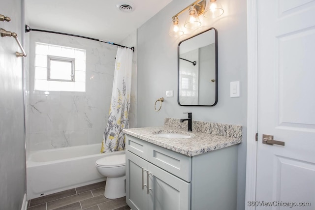 full bathroom featuring vanity, shower / bath combo, and toilet