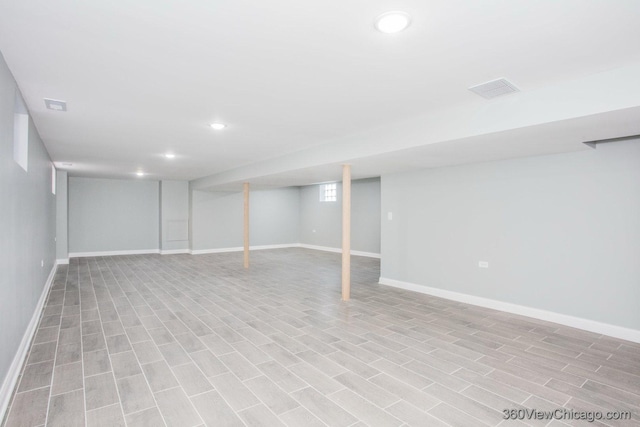 basement featuring recessed lighting, visible vents, and baseboards