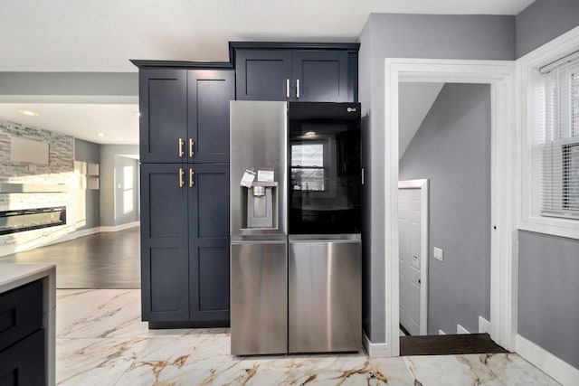 kitchen with stainless steel fridge with ice dispenser