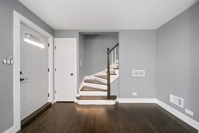 foyer with dark hardwood / wood-style floors