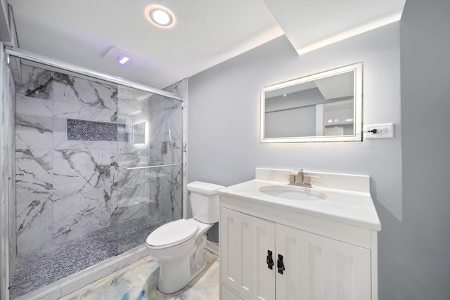 bathroom with an enclosed shower, vanity, and toilet