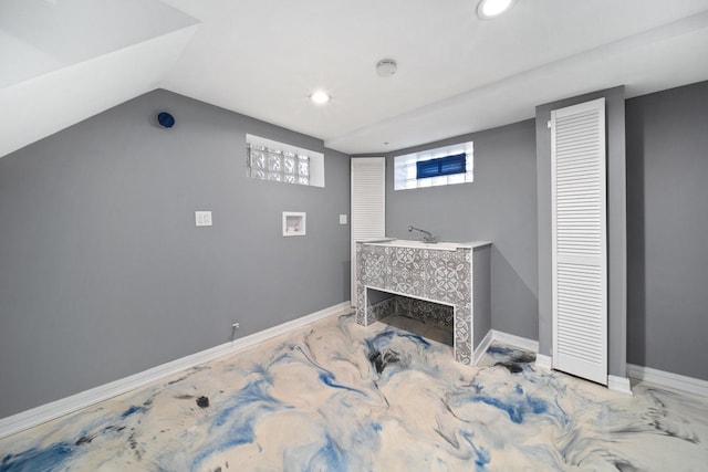 living room featuring a tiled fireplace