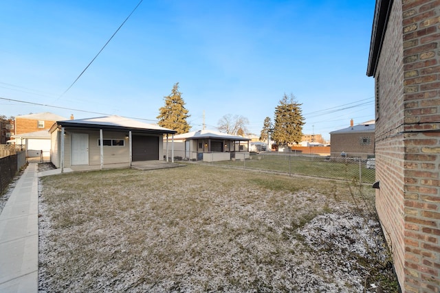 view of yard featuring an outbuilding and a garage