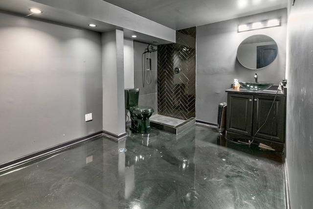 bathroom featuring a shower and vanity