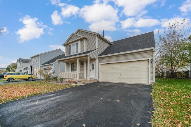 view of front property with a porch and a garage