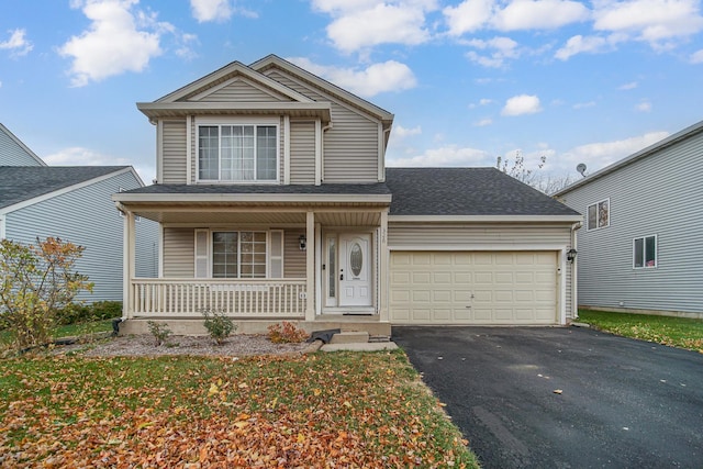 front facade with a front yard, a porch, and a garage