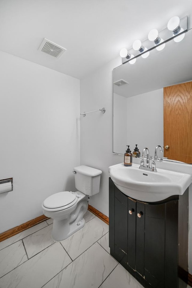 bathroom with vanity and toilet