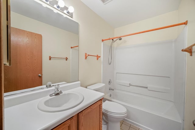 full bathroom featuring tile patterned flooring, bathtub / shower combination, vanity, and toilet