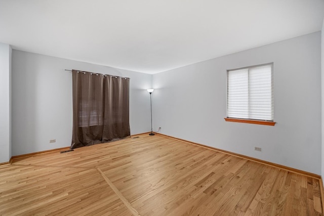 unfurnished room featuring light wood-type flooring