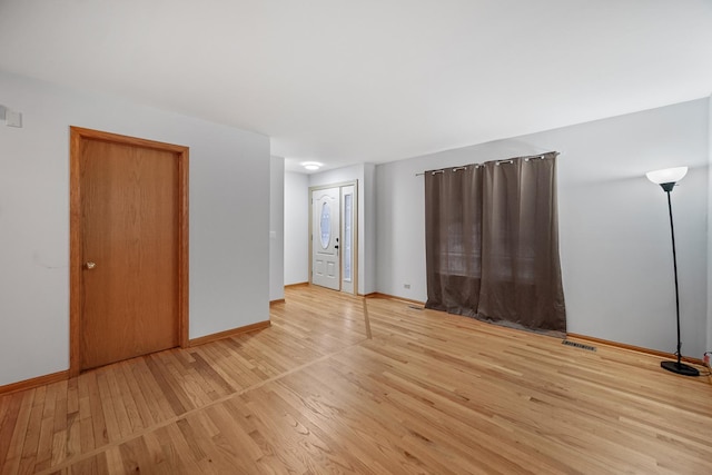 unfurnished room featuring light wood-type flooring