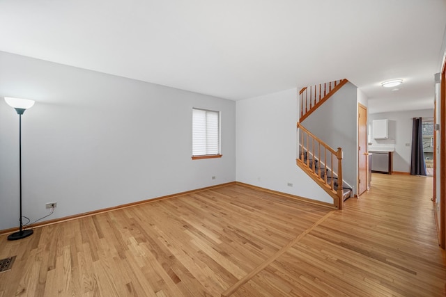 unfurnished room featuring light wood-type flooring