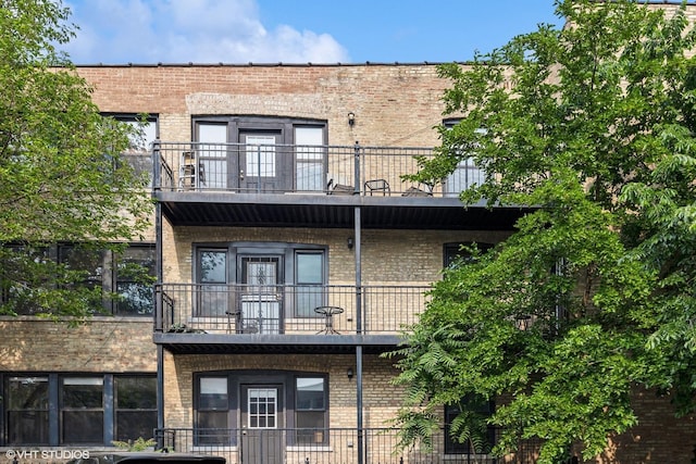 rear view of house featuring a balcony