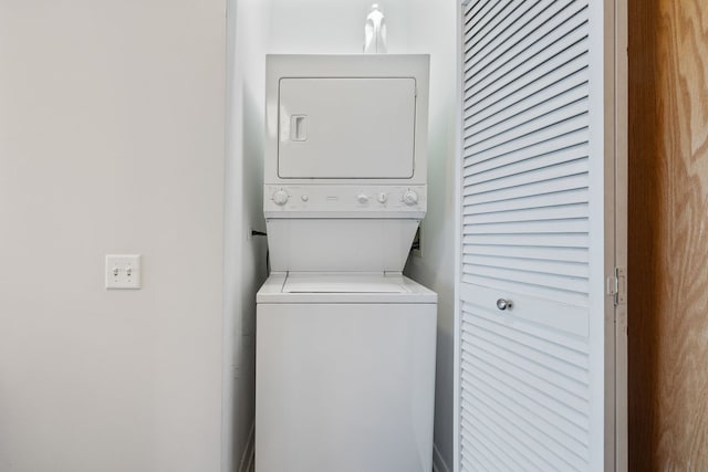 laundry area featuring stacked washer and dryer