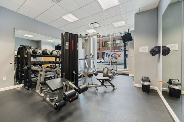 exercise room featuring a drop ceiling