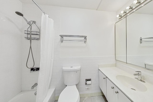 full bathroom with shower / tub combo with curtain, vanity, tile walls, and toilet