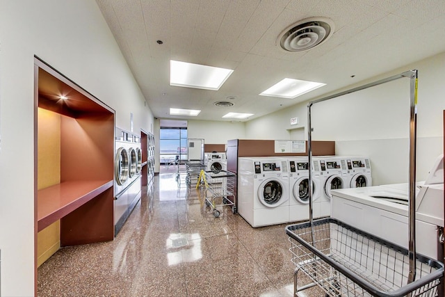 washroom featuring stacked washer and clothes dryer and washing machine and dryer