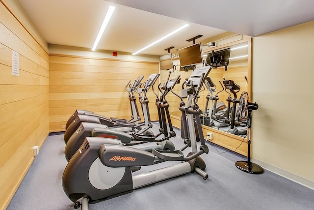 gym featuring wooden walls