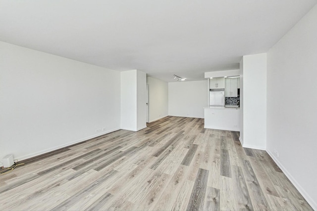 unfurnished living room featuring light hardwood / wood-style flooring