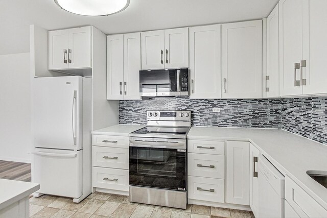 kitchen featuring white cabinetry, tasteful backsplash, and stainless steel appliances