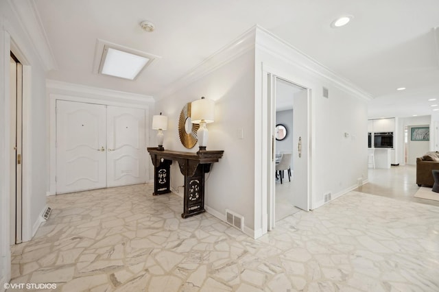 hallway featuring ornamental molding