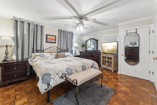 bedroom with crown molding, dark parquet floors, and ceiling fan