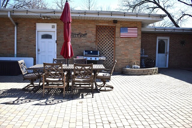 view of patio / terrace with central AC and a storage shed