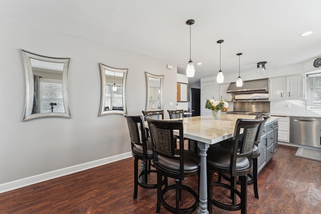 dining area with dark hardwood / wood-style flooring