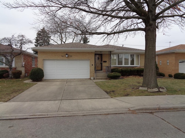 ranch-style home with a garage and a front lawn