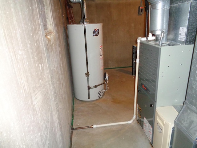 utility room with heating unit and water heater