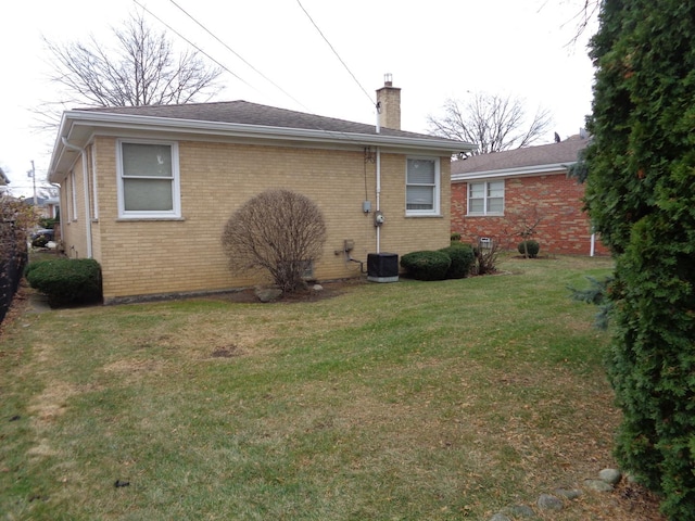 rear view of house with a yard