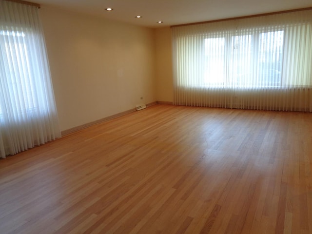 unfurnished room with light hardwood / wood-style flooring