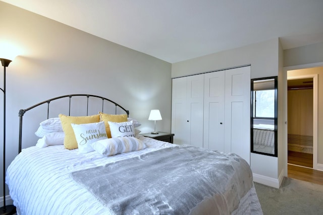 carpeted bedroom featuring a closet