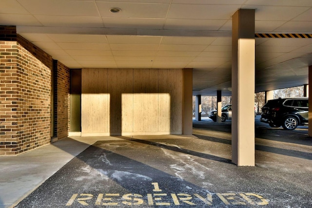 garage featuring wood walls