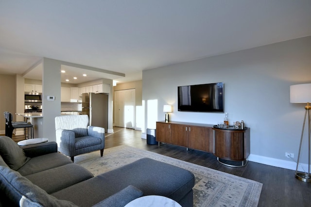 living room with dark hardwood / wood-style flooring