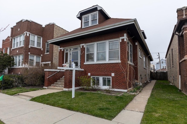 view of front of home with a front lawn