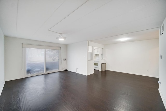 unfurnished living room with dark hardwood / wood-style flooring