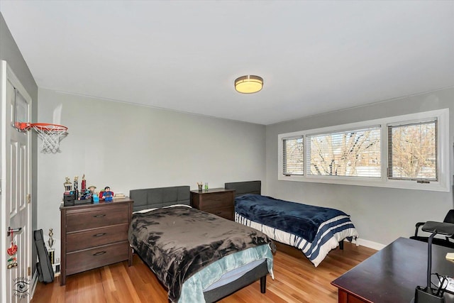 bedroom with light hardwood / wood-style flooring