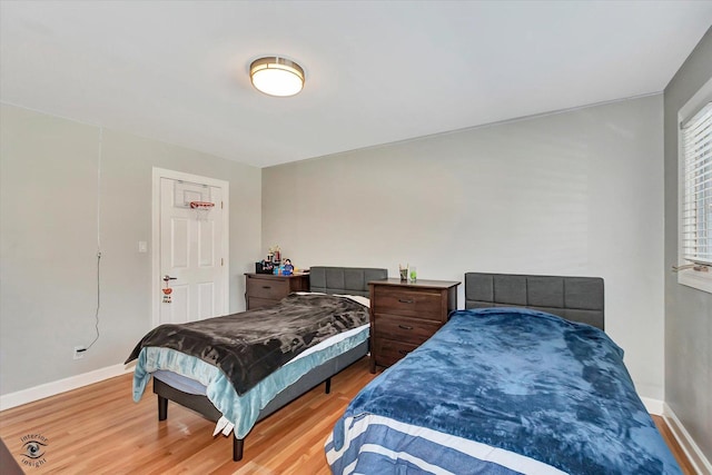 bedroom with wood-type flooring