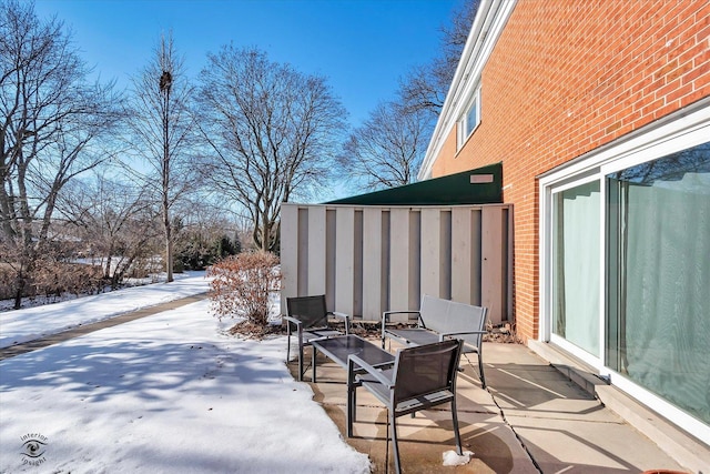 view of snow covered patio