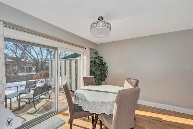 dining room with light wood-type flooring