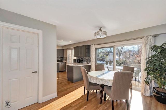 dining space with light wood-type flooring