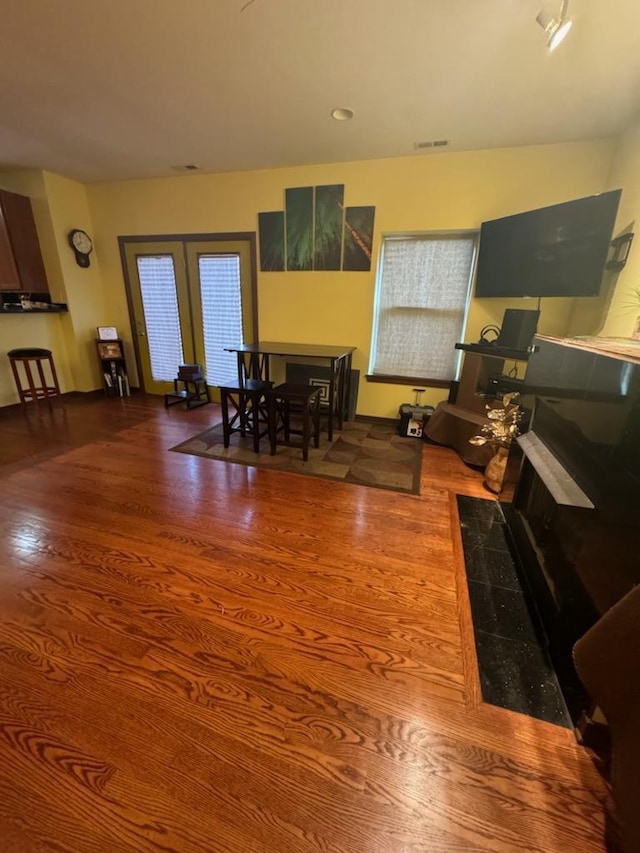 dining space with hardwood / wood-style floors